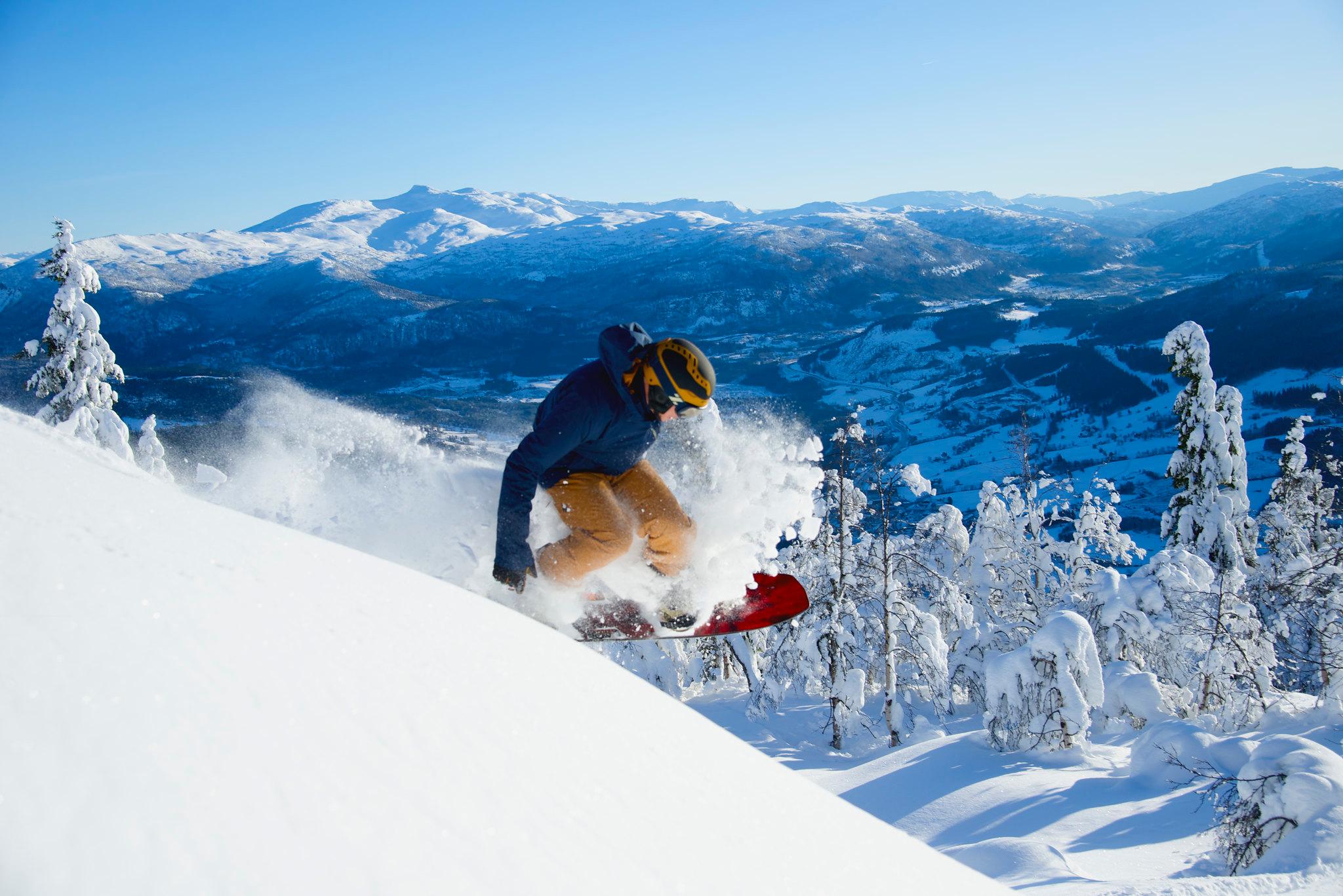 A snowboard blasts through the powder in the Norway ski resort of Voss