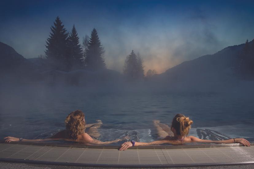 Couple enjoying thermal spa hot tub at Megeve ski resort
